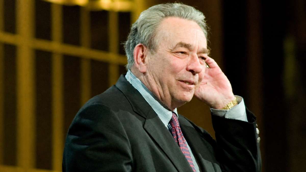R.C. Sproul smiling while seated during a public event